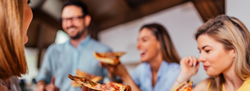 group of coworkers enjoying pizza | will accountability hurt company culture